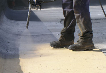 Coating systems over Arlington spray foam roof systems